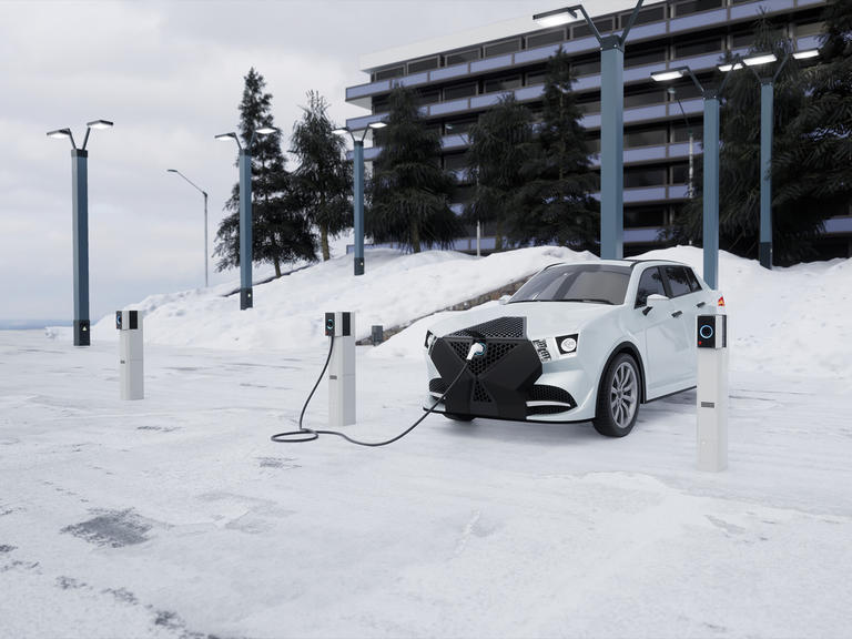 Electric car charging in snow
