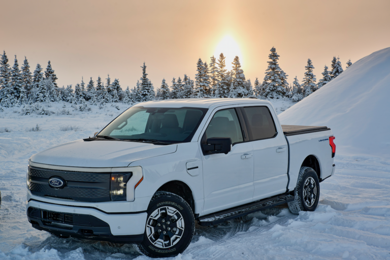 A Ford F-150 Lightning parked in the Alaskan wilderness.