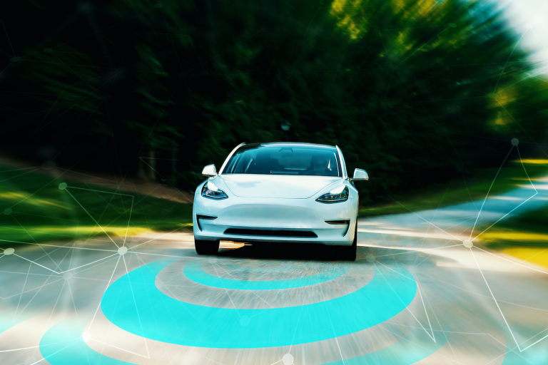 Autonomous vehicle driving on road toward camera