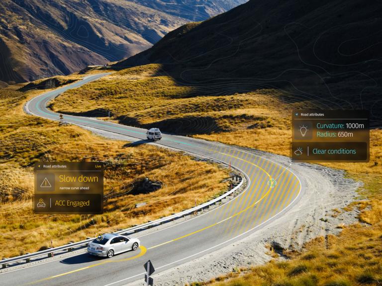A car uses adaptive cruise control features to navigate a windy road.