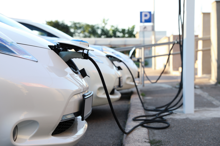 Cars plugged into chargers at charge station
