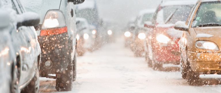 A snarl of traffic during a heavy snowstorm.